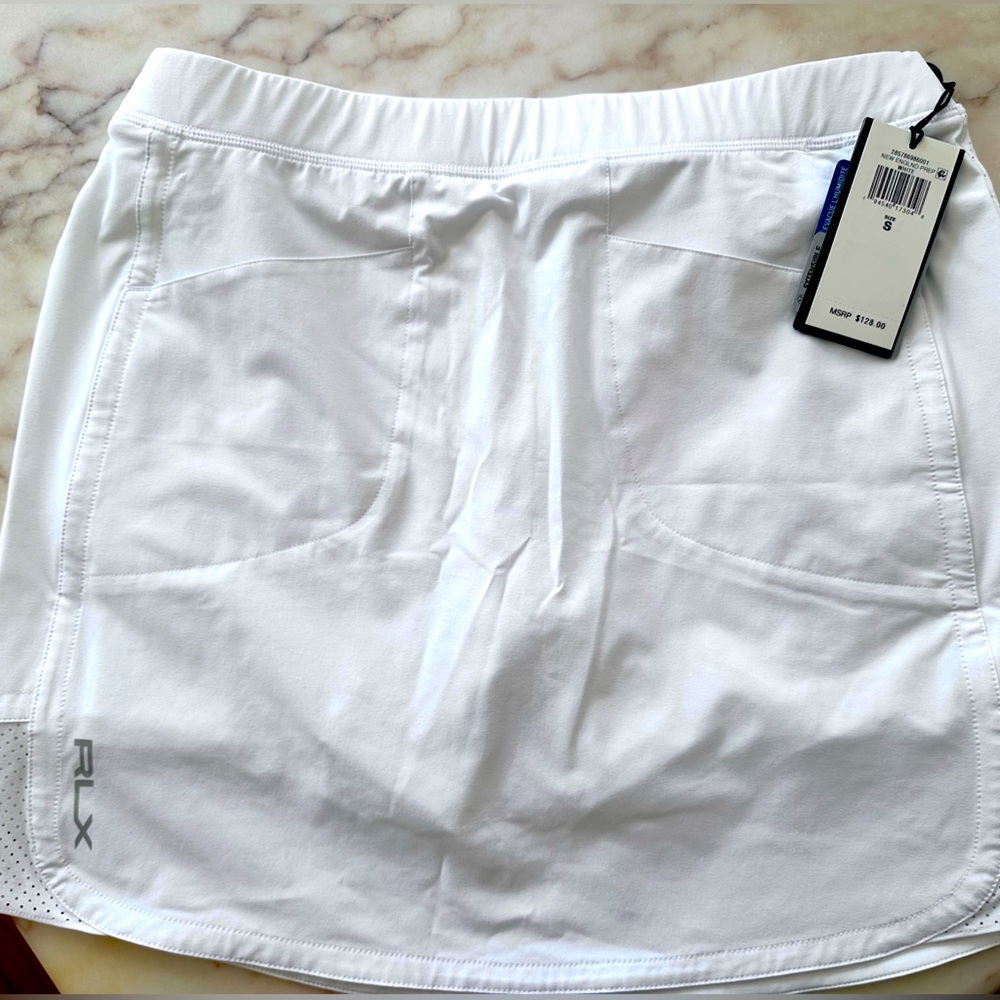 I have four of these available. Brand new w/tags all size small.RLX golf skirt.